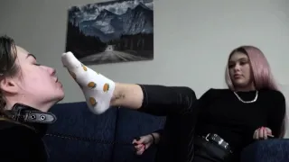 girl licks her friends feet